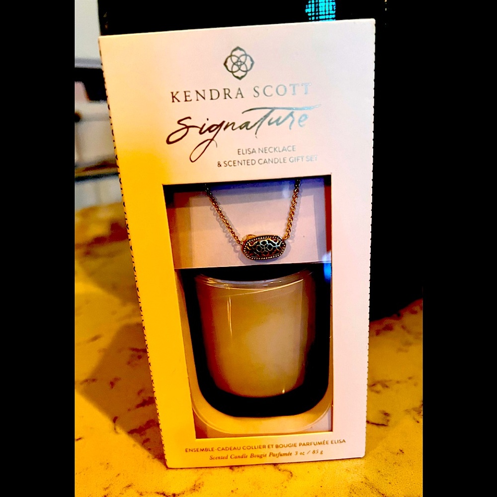 Kendra Scott Signature Series candle and Elisa necklace in gold.